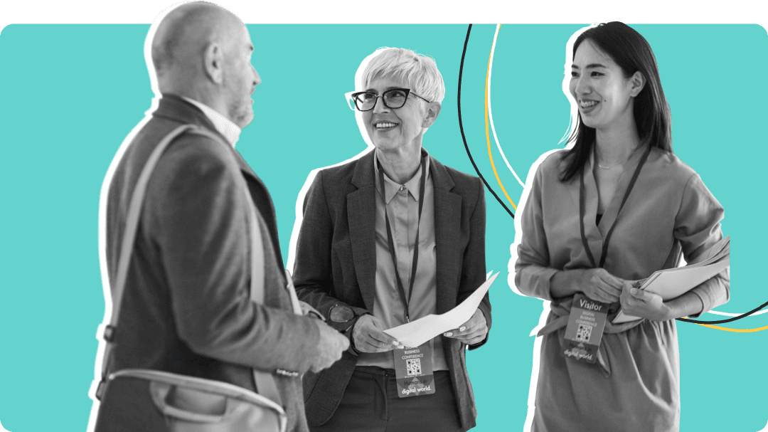 Three people talking at a conference